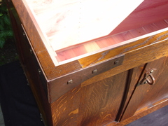 Close-up of splined corner construction, hand-hammered copper corner strap attached with pyramid screws and Cedar lined interior.